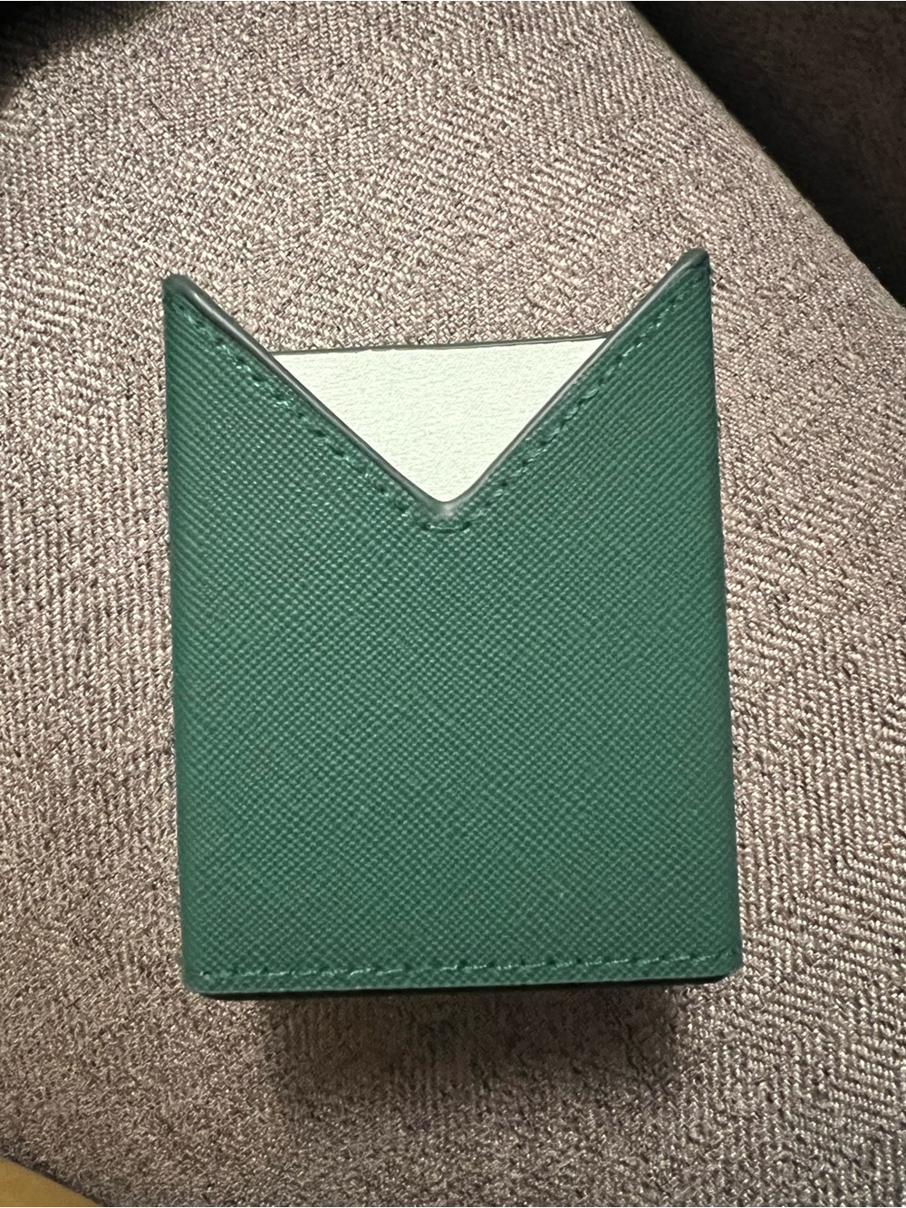 Prada Paradigma perfume case featuring a V-notch design.